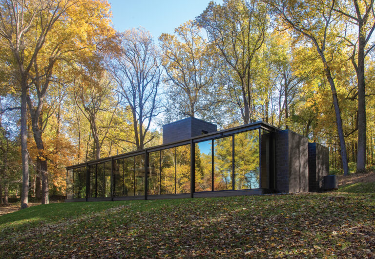 A minimalist glass, steel and masonry house enjoys privacy on its secluded, woodsy Owings Mills, Maryland, site.