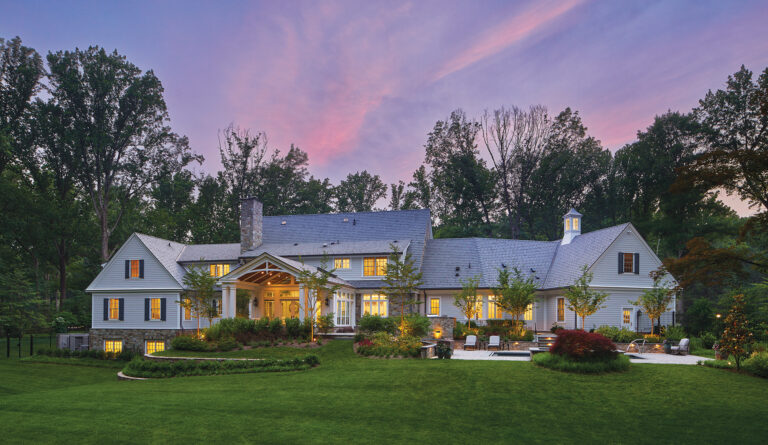 Handsome stonework, a slate roof, a cupola and meticulous landscaping enhance a new custom residence in Potomac Falls.
