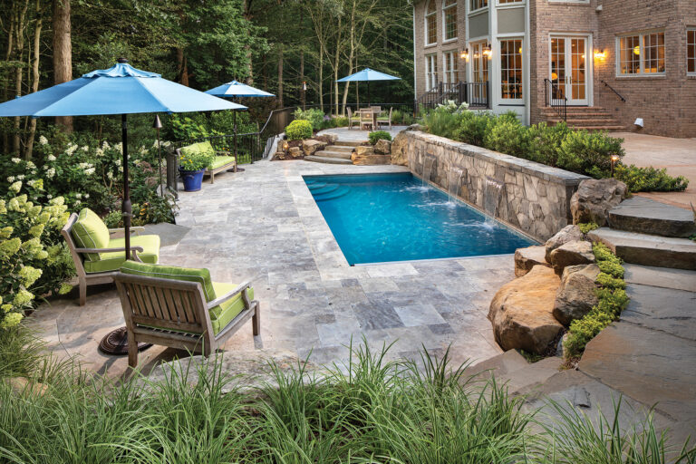 A split-level patio frames a swimming pool sized to fit a tight backyard space in Great Falls.