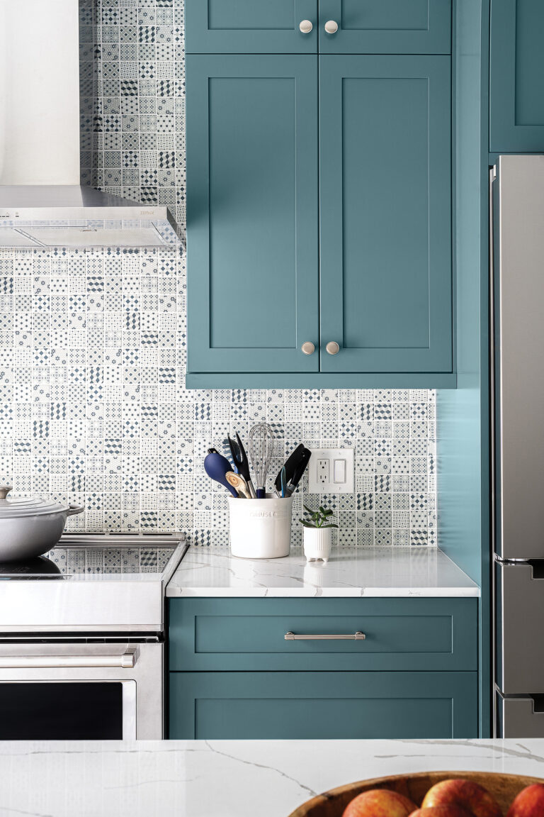 A town home kitchen features Cabinet Concepts cabinetry and a playful Daltile backsplash.