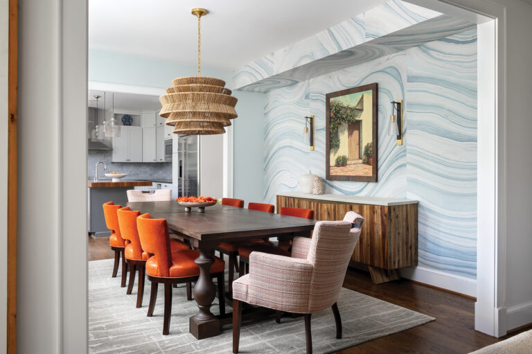 The modern-eclectic dining room showcases aqua-toned, hemp wallcovering that mimics ripples on the water.