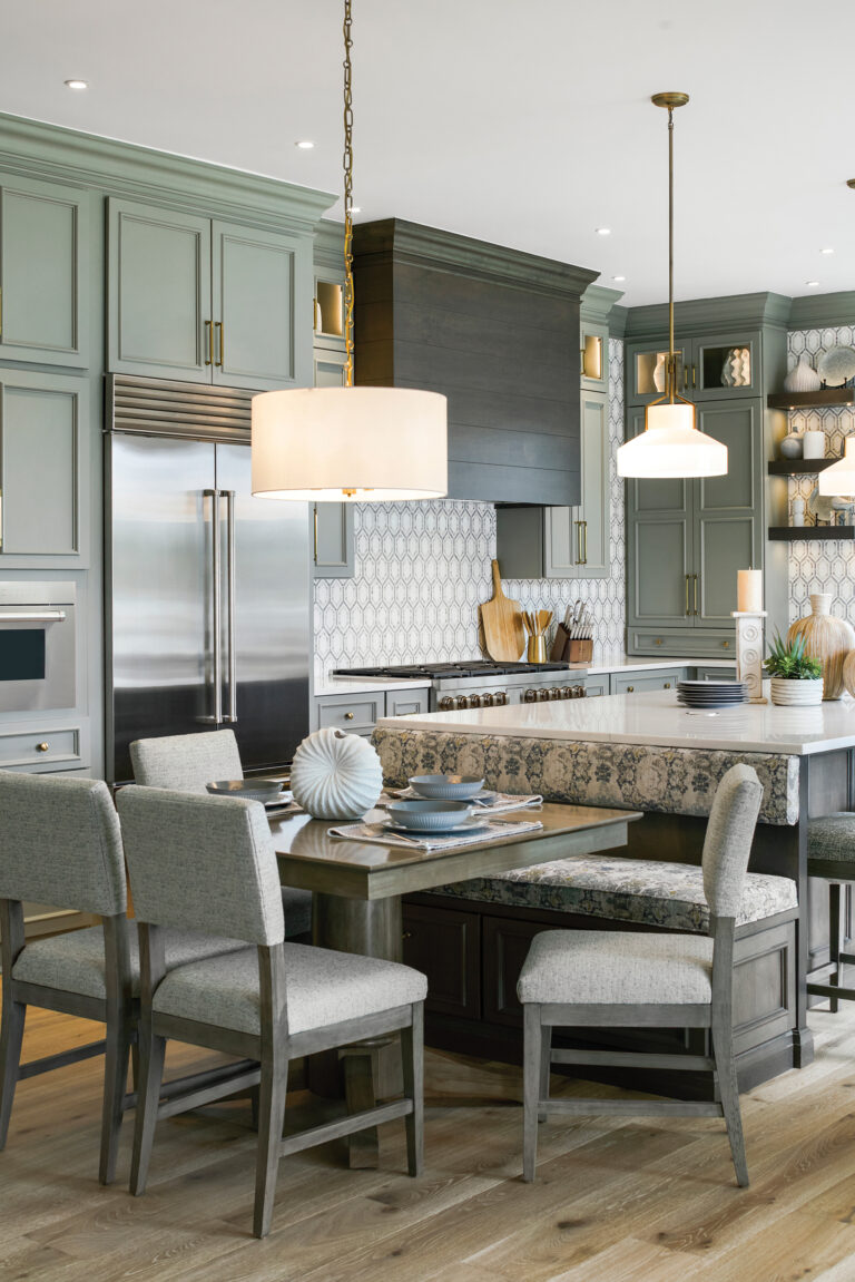 In the kitchen of her Dividing Creek project, Fitzsimmons combined sea green cabinets with walls clad in marble mosaic tile.