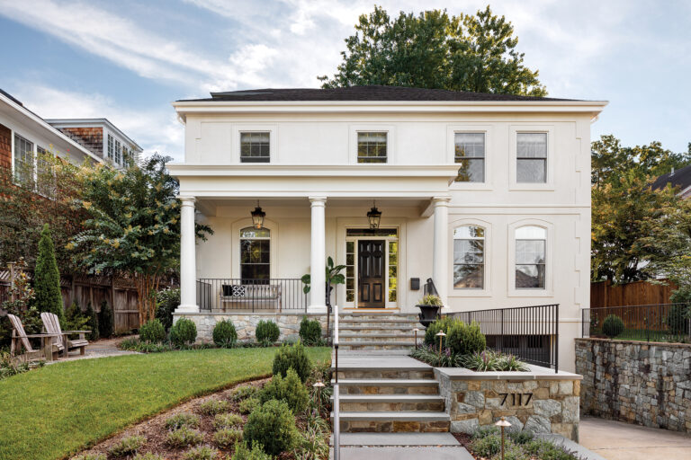 The front façade of a Bethesda abode was reimagined with a new porch; a revamped driveway improves the home’s approach.