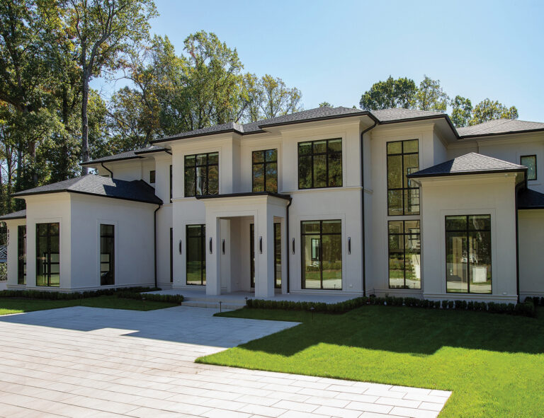 A McLean custom dwelling balances modern and classic styling with clean lines and large window walls.