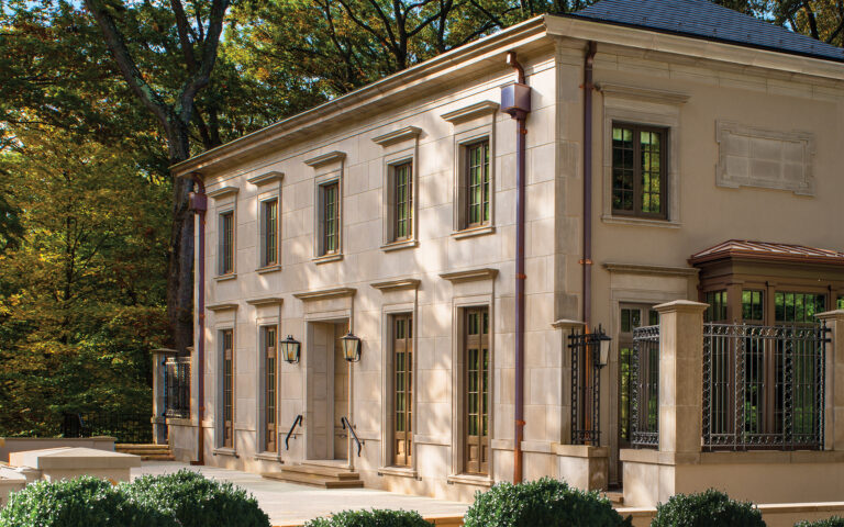 Following the strict principles of neoclassical architecture, detailed Indiana cut limestone distinguishes this new home.