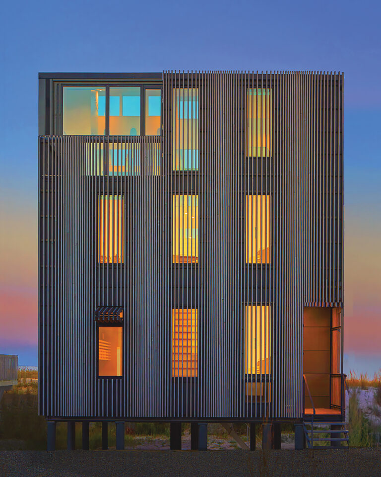 A beachfront property filters light through a screen inspired by dune fencing. On the opposite waterside, three floors of windows culminate with a top floor of 16-foot high glass.