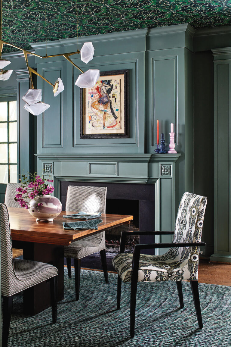 Extensive, deep-hued millwork distinguishes an elegant, welcoming dining room.