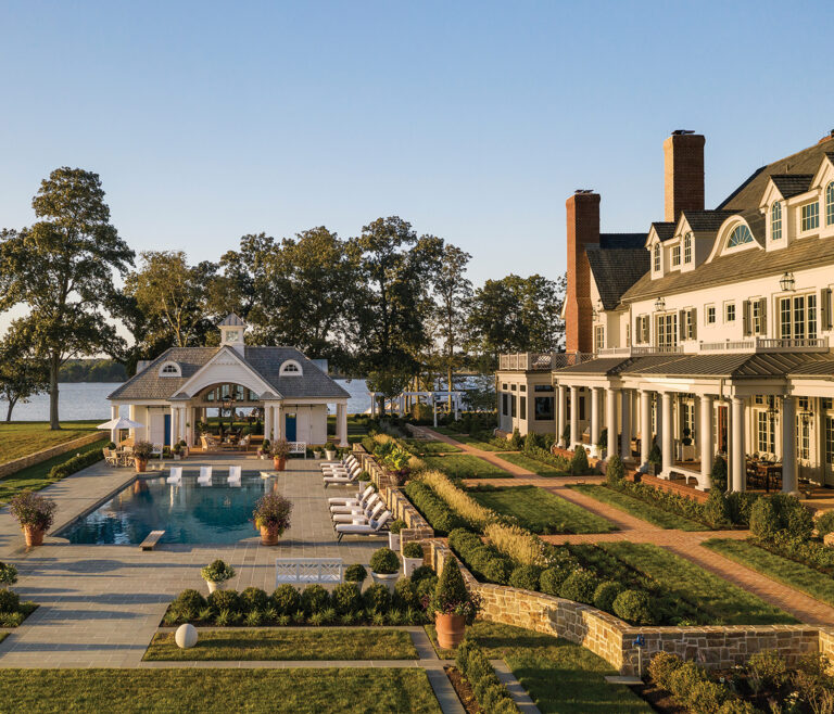 An Eastern Shore estate reinterprets classical architecture through a more livable lens. Painted brick, vertical board-and-batten, horizontal shiplap and a white cedar shake roof suit the locale.