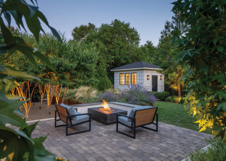 An intimate fireside seating area is integrated into the landscape.