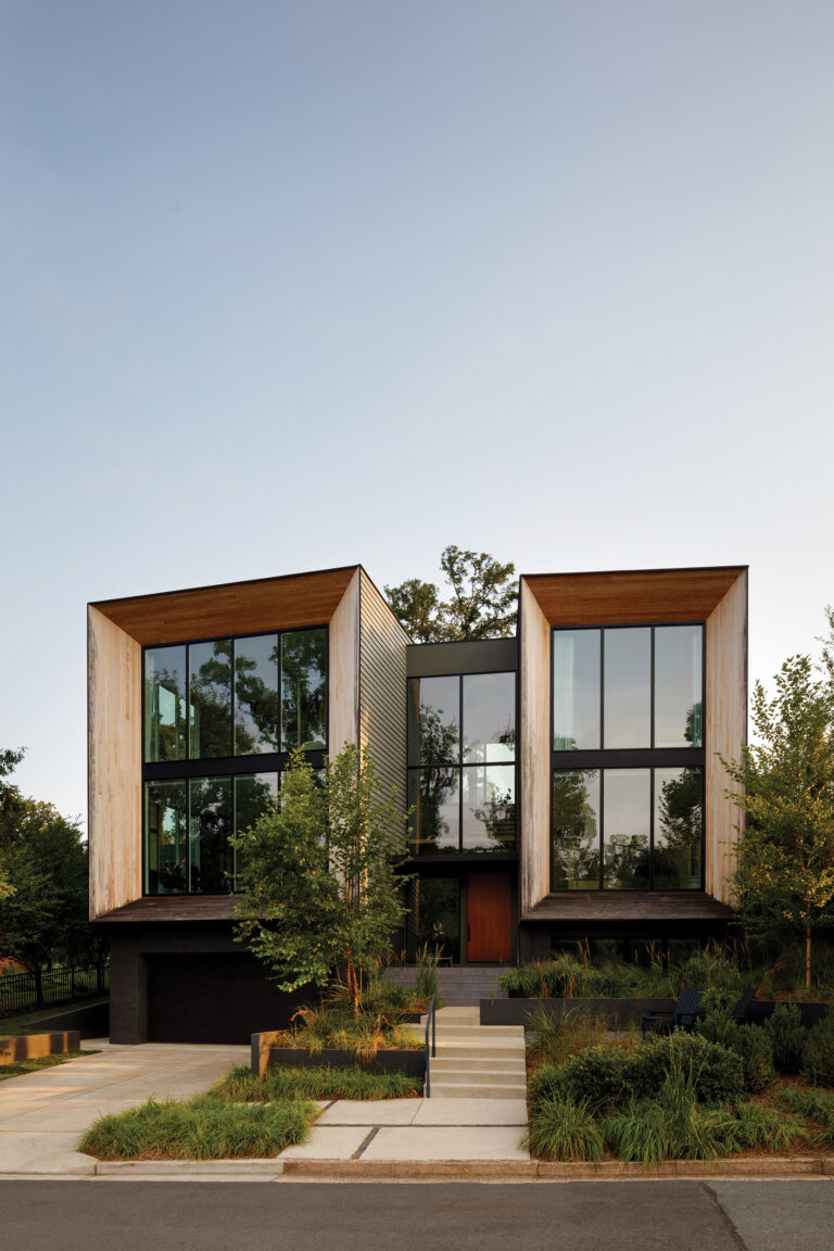 Glass-fronted pavilions define a striking modern composition, unified by warm materials, precise detailing and a nuanced interplay of form, light, and texture.
